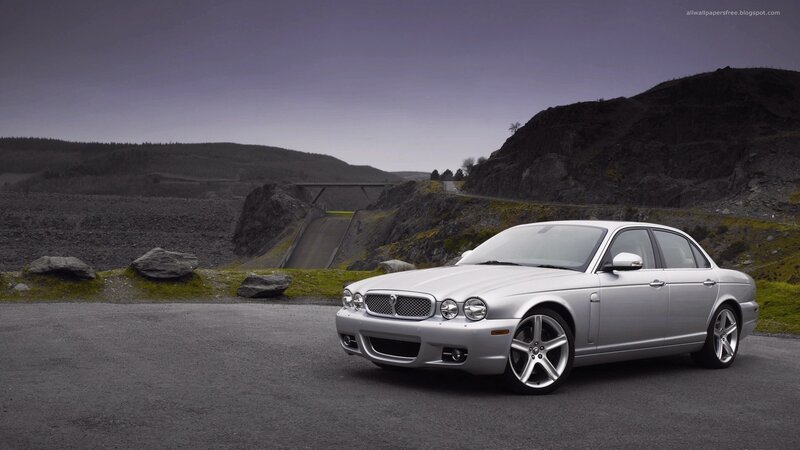 silver jaguar xj on a road