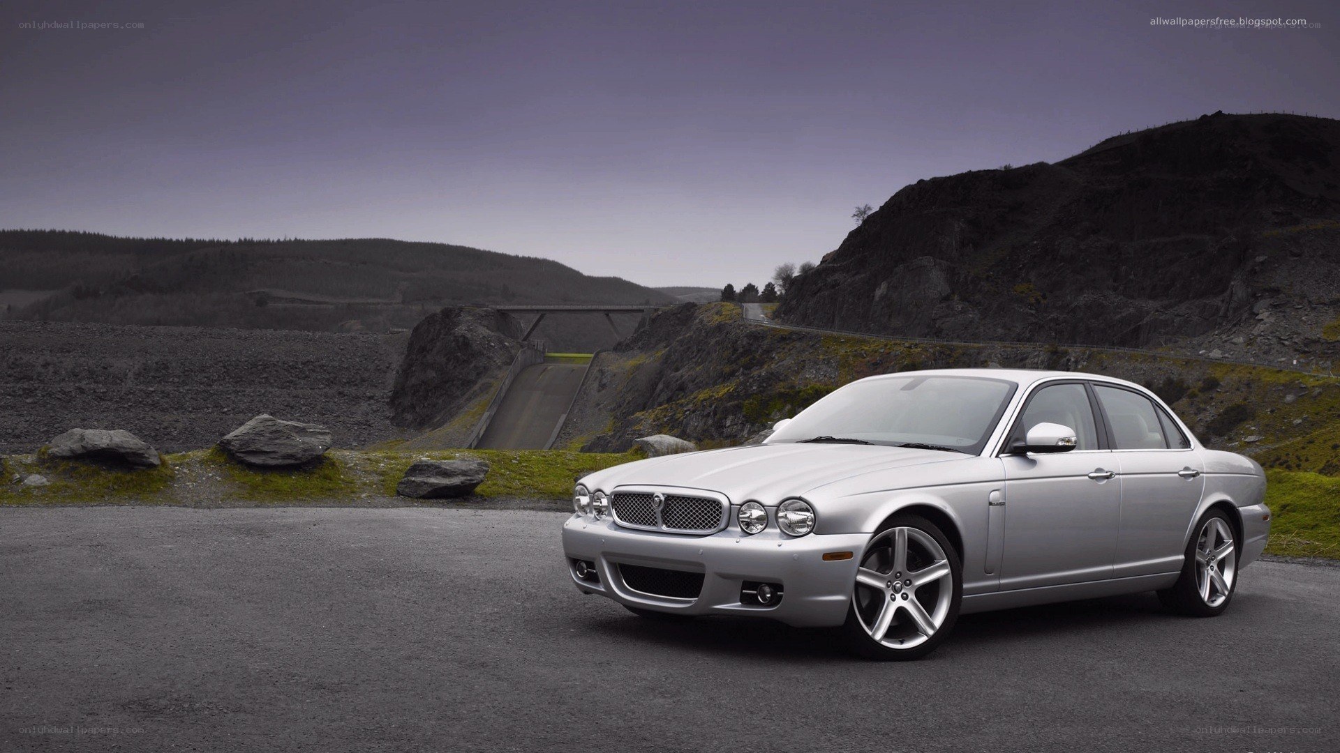 silver jaguar xj on a road