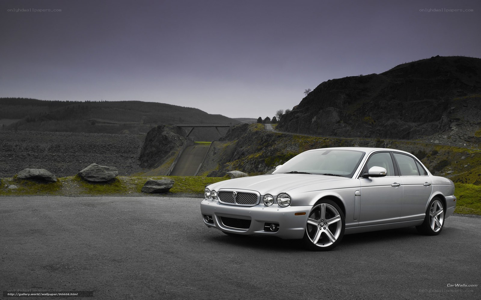 Silver Jaguar XJ on a road