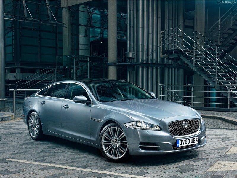 Silver Jaguar XJ parked in city