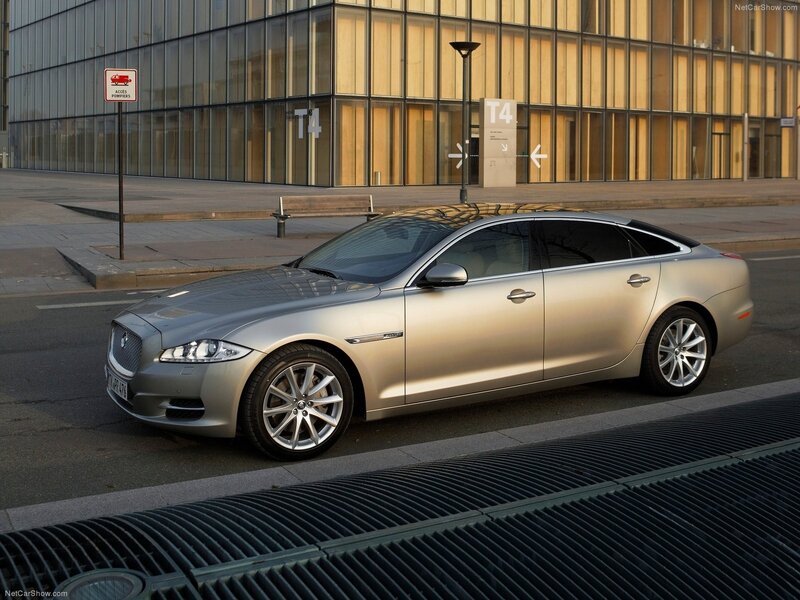 silver jaguar xj parked in city