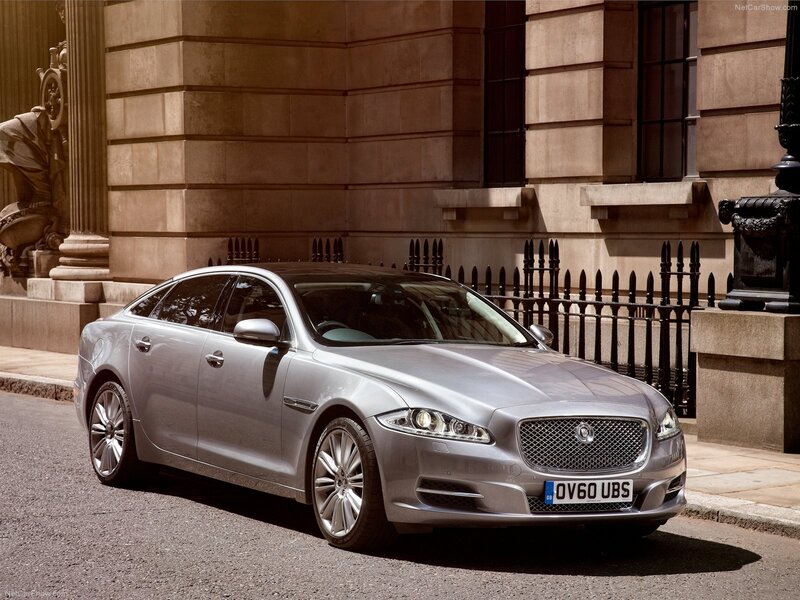 silver jaguar xj parked on street