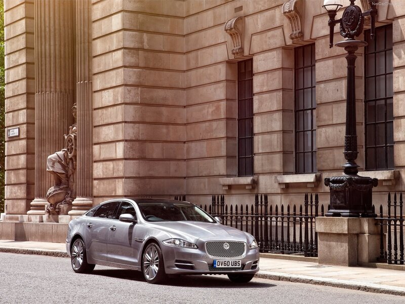 Silver Jaguar XJ parked on street