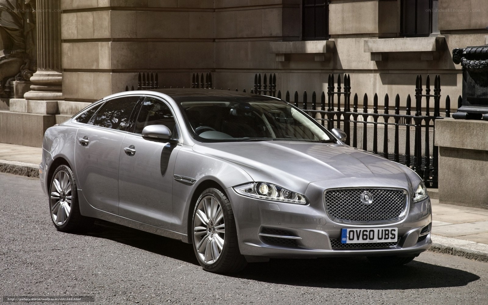 Silver Jaguar XJ parked on street