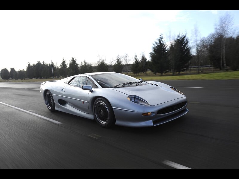 silver jaguar xj220 on track
