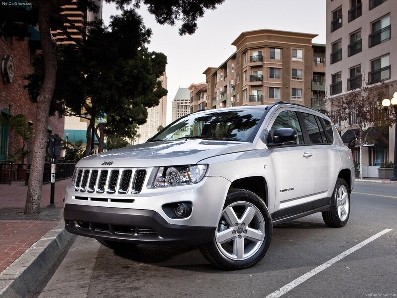 Silver Jeep Compass parked on street