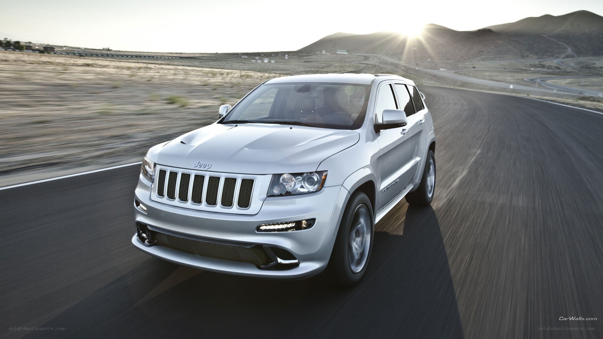 silver jeep driving on road