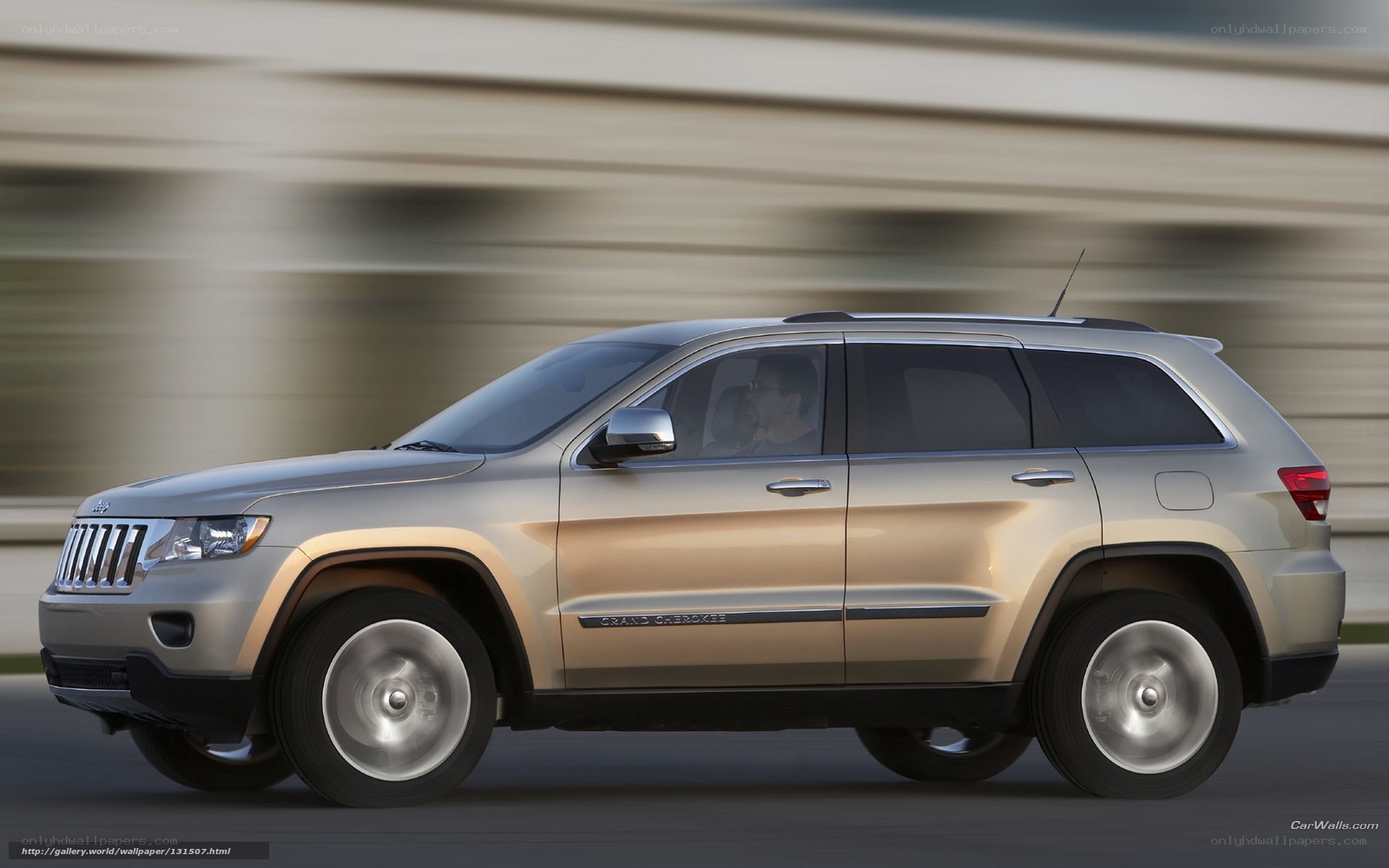 silver jeep grand cherokee in motion