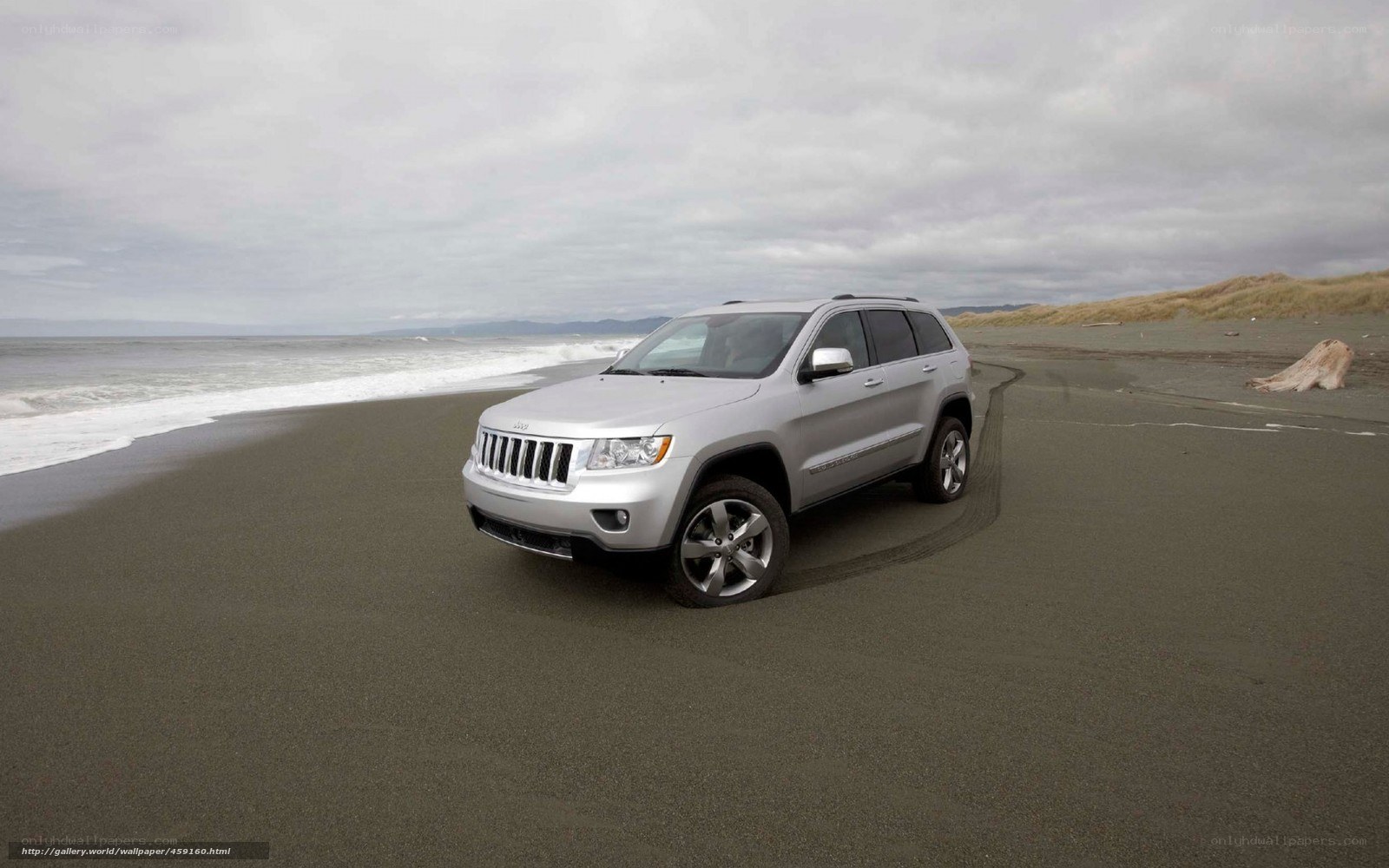 Silver Jeep on a beach