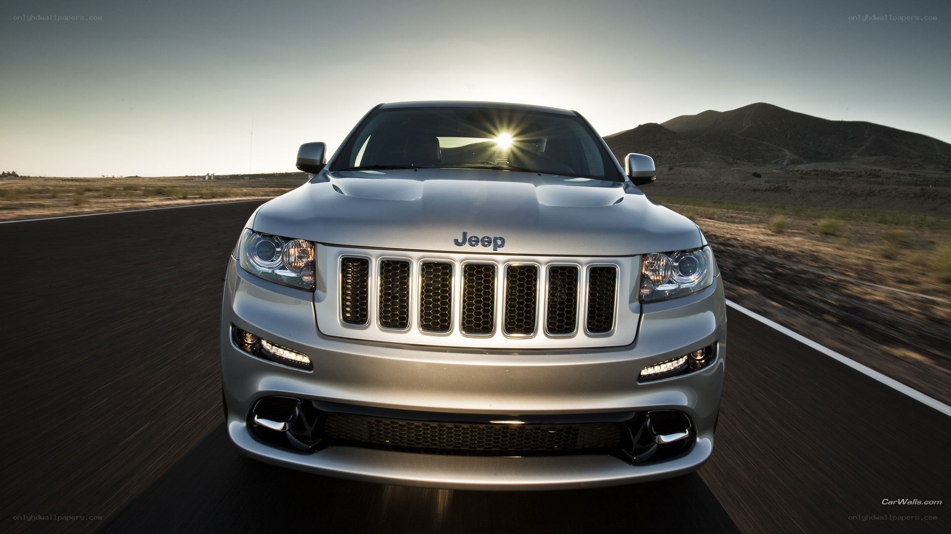 silver jeep on desert road