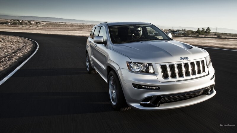 silver jeep suv on a road