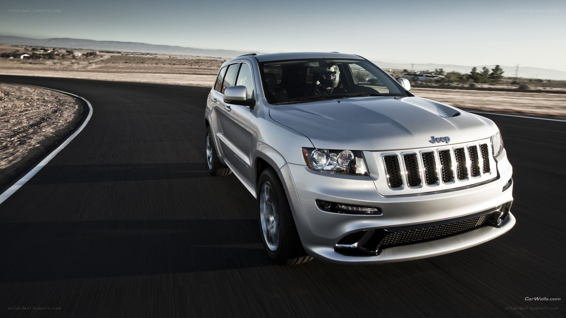 silver jeep suv on a road