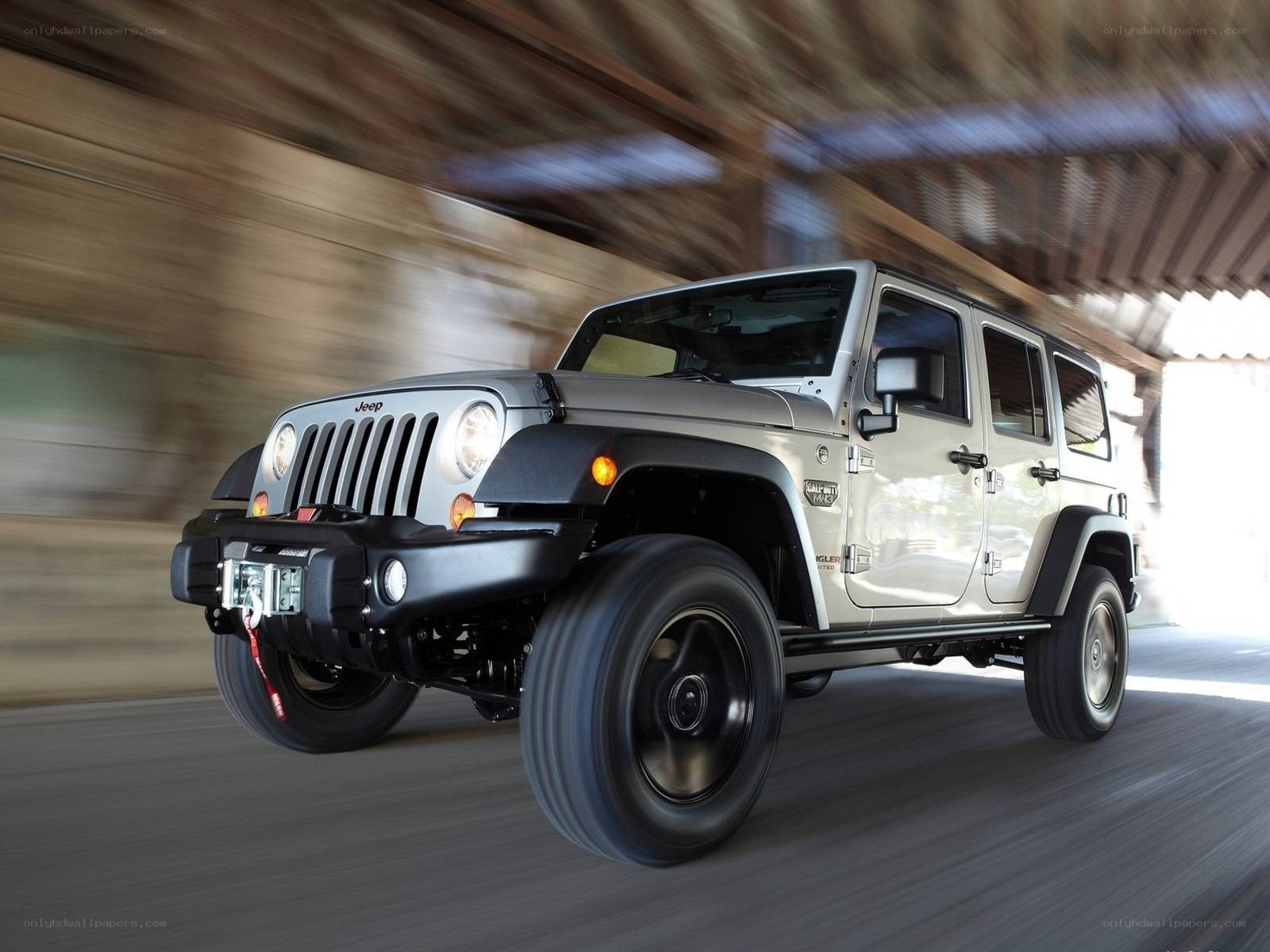 Silver Jeep Wrangler in motion