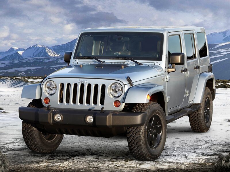 Silver Jeep Wrangler in snowy landscape
