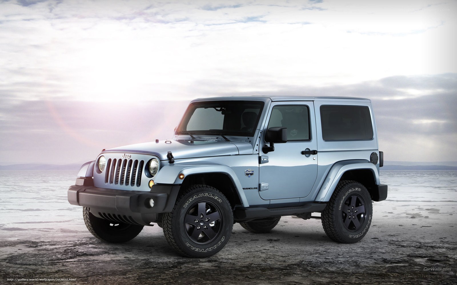 Silver Jeep Wrangler on beach