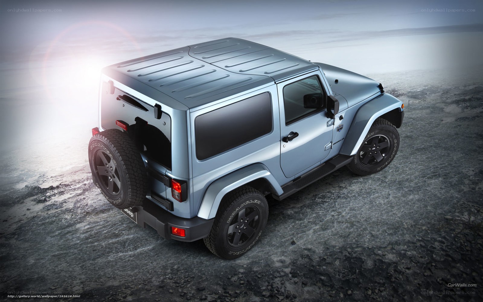 silver jeep wrangler on rocky terrain