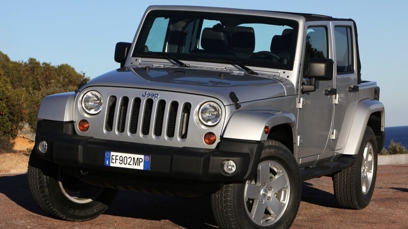 Silver Jeep Wrangler parked outdoors