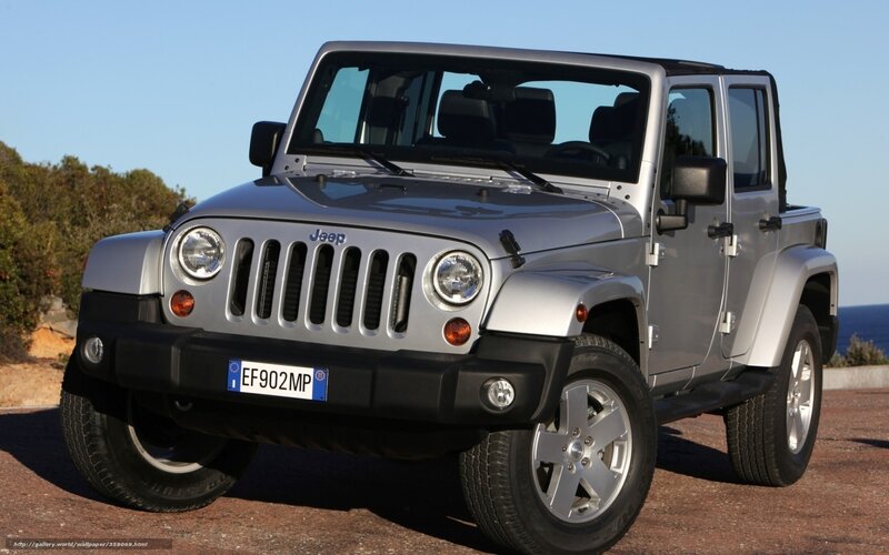 Silver Jeep Wrangler parked outdoors