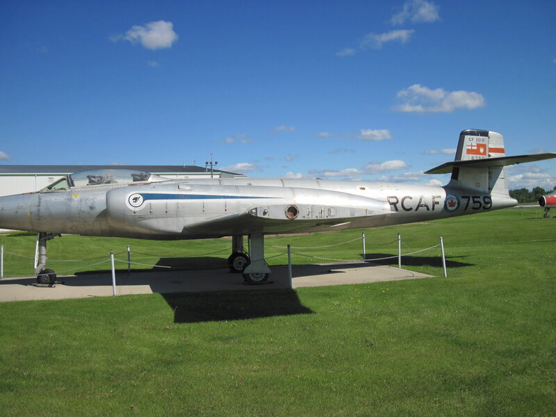 Silver Jet Aircraft — Green, Outdoor, Afternoon