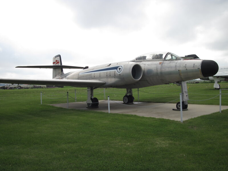 Silver Jet Aircraft — Green, Overcast, Afternoon