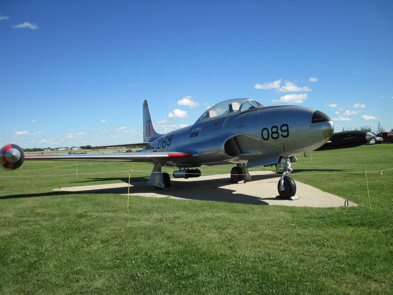 Silver Jet Aircraft — Green, Serene, Afternoon