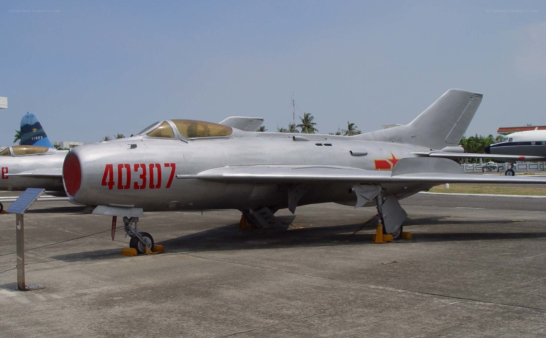 Silver jet fighter on display