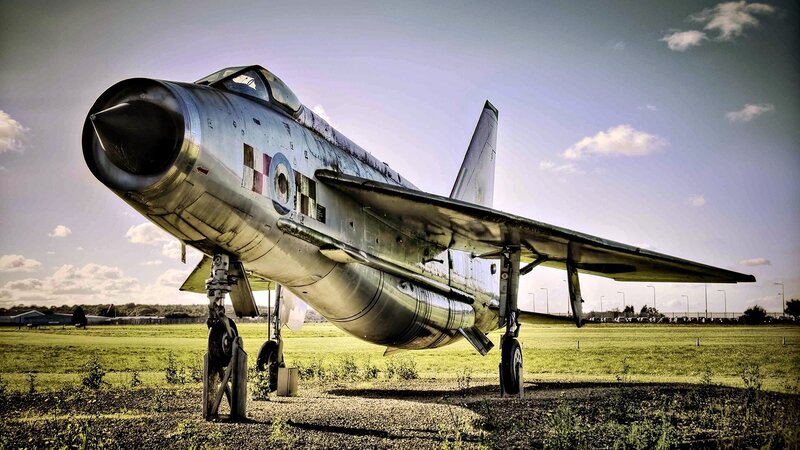 Silver Jet Fighter Plane — Green, Dramatic, Afternoon, Photograph