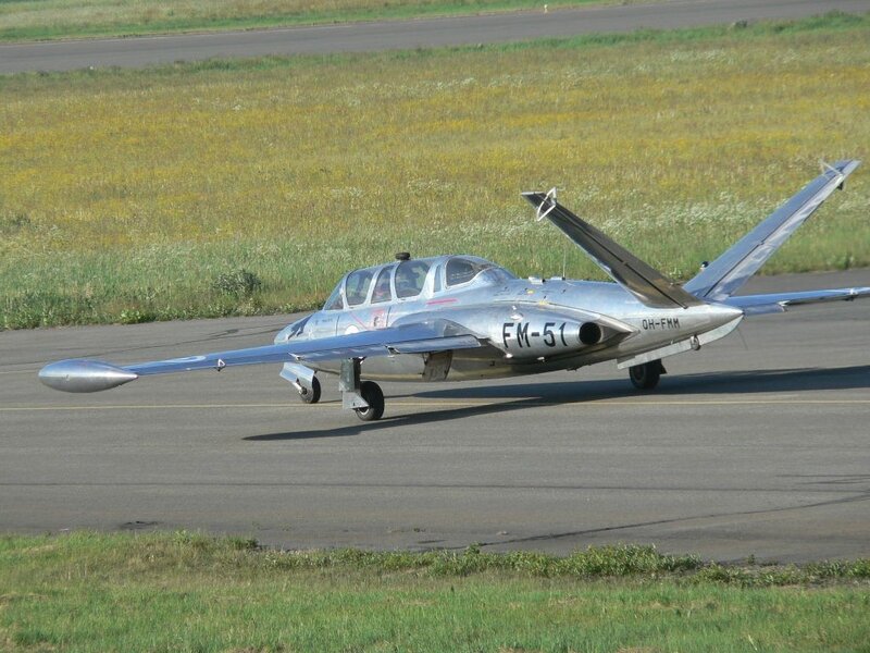 Silver jet on runway