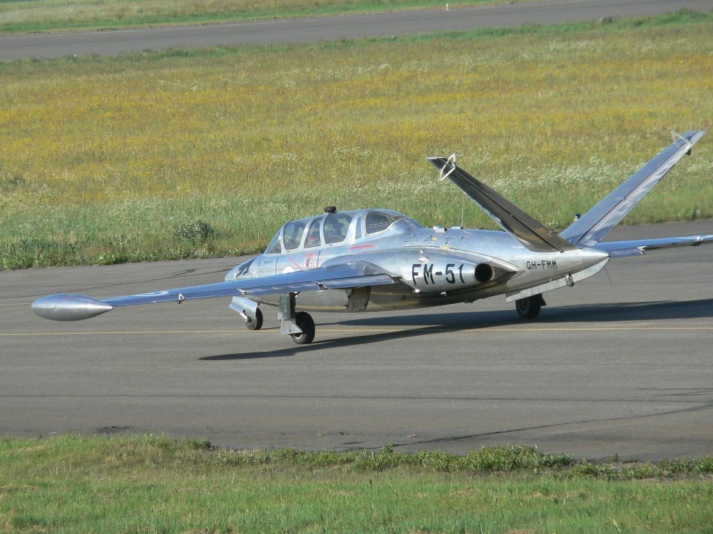 Silver jet on runway