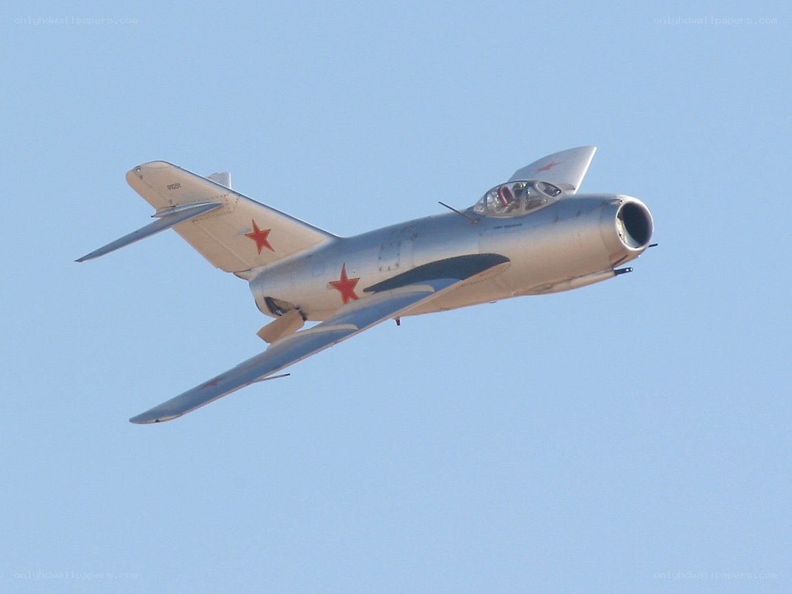 silver jet with red stars