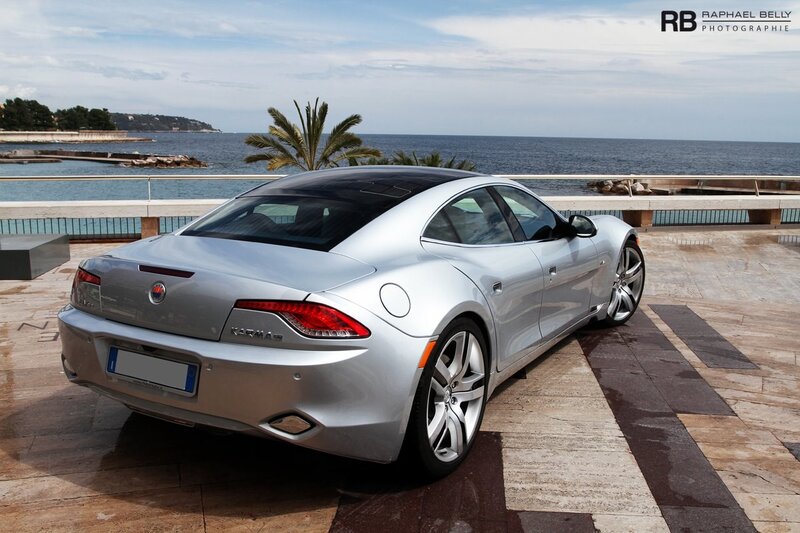 Silver Karma car by the sea