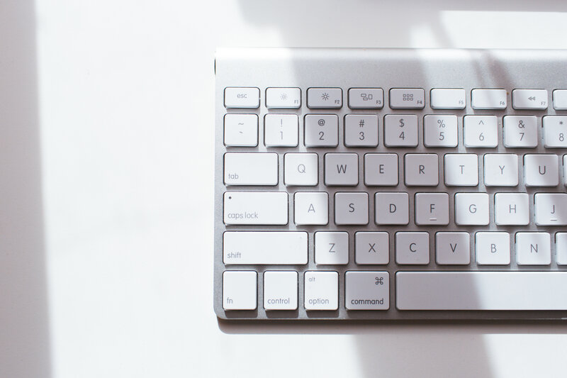 silver keyboard on white surface