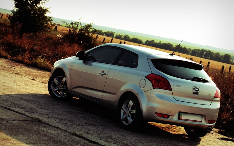silver kia cee'd on country road