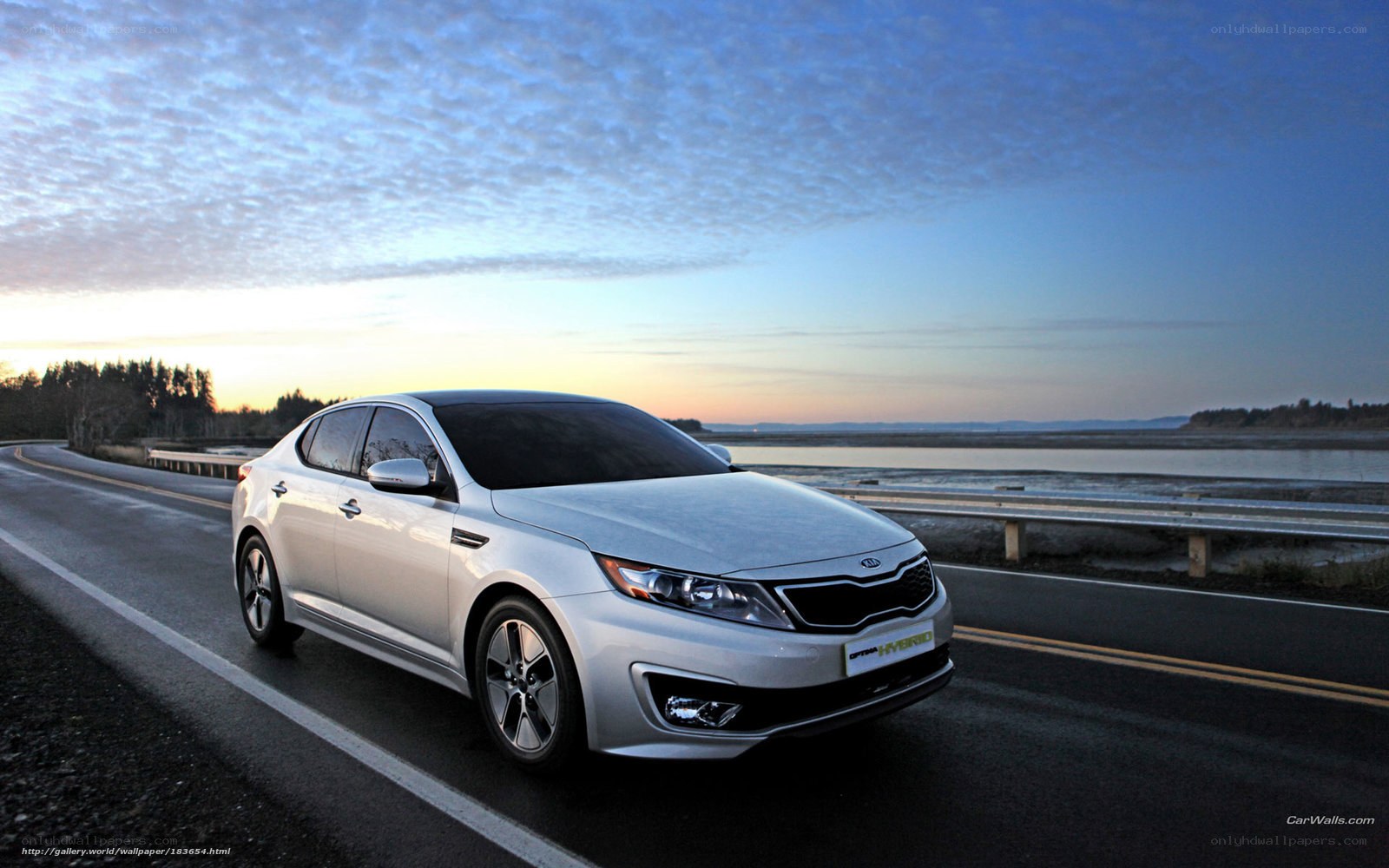 Silver Kia Optima Hybrid on road