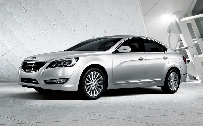 silver kia sedan in showroom