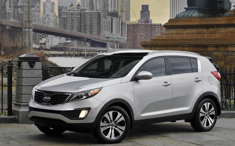 Silver Kia Sportage in city