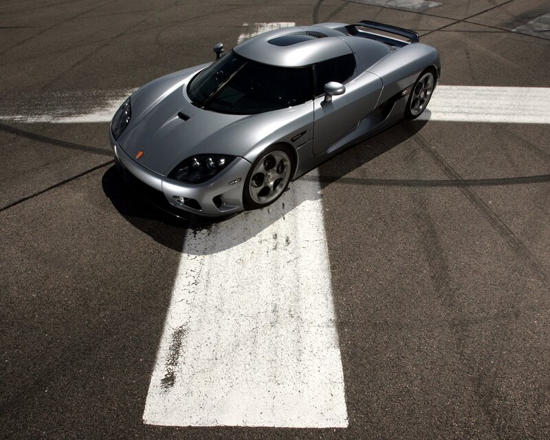 Silver Koenigsegg on racetrack