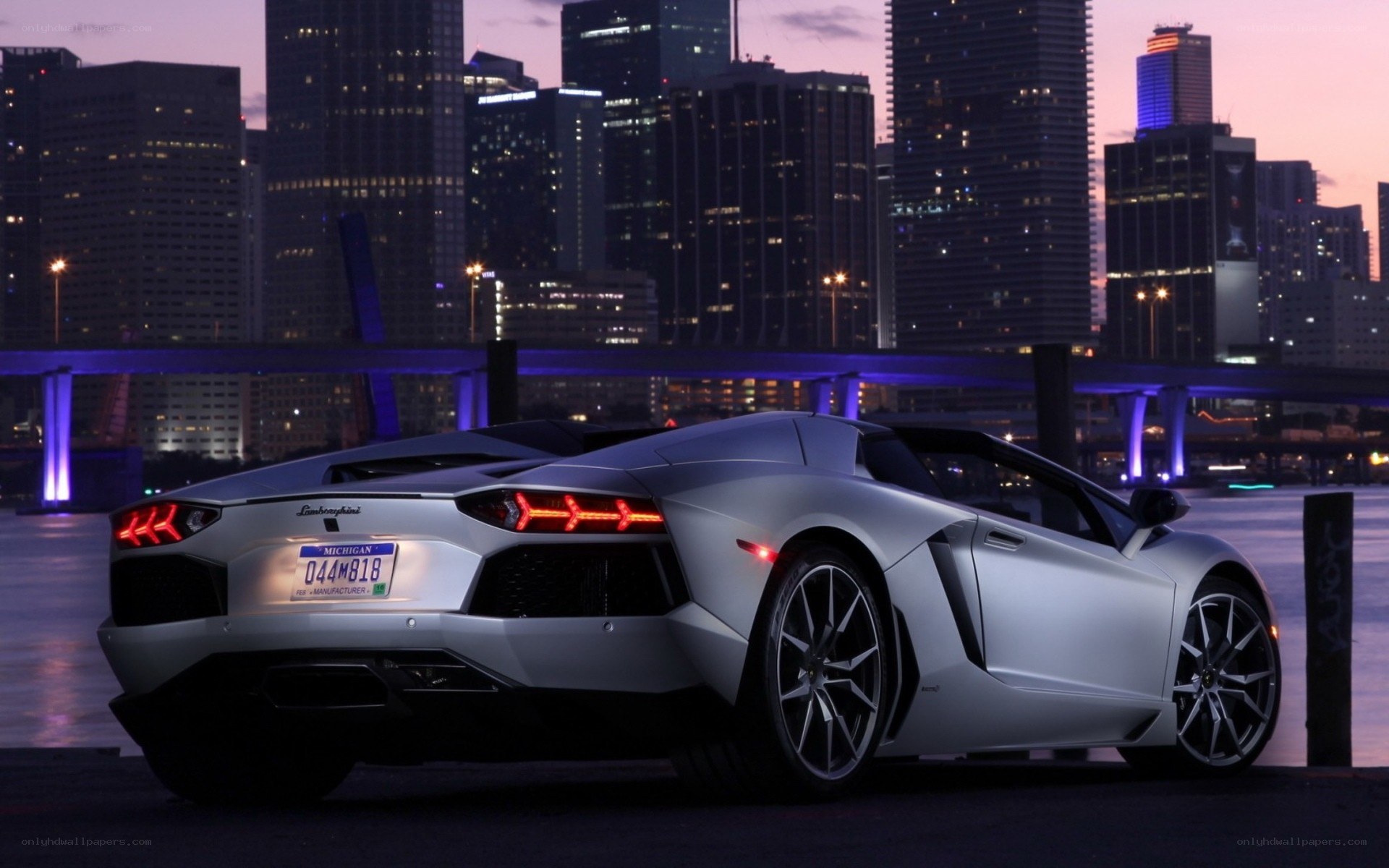 Silver Lamborghini at dusk