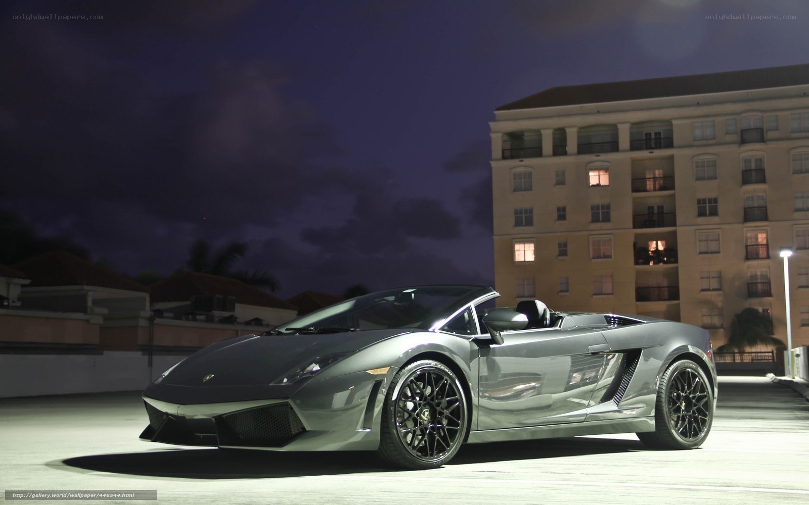 Silver Lamborghini at night