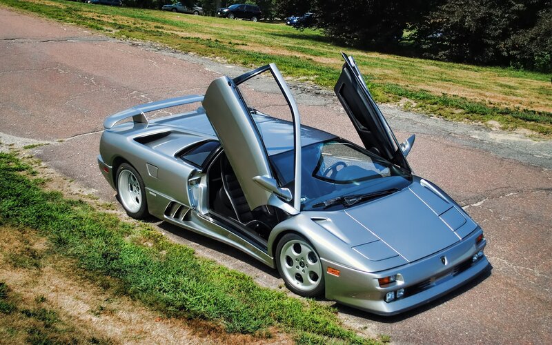 Silver Lamborghini Diablo with doors open