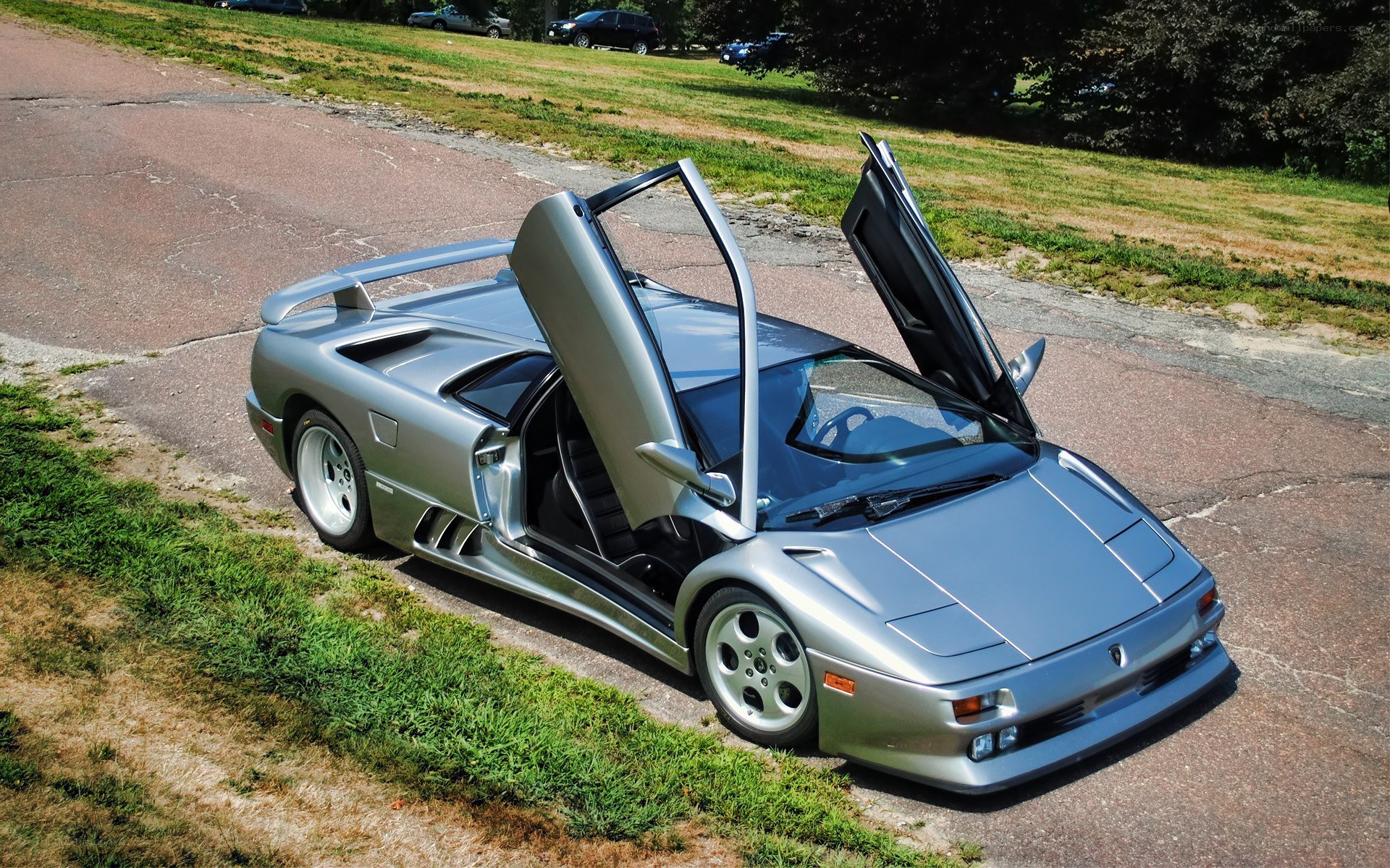 Silver Lamborghini Diablo with doors open