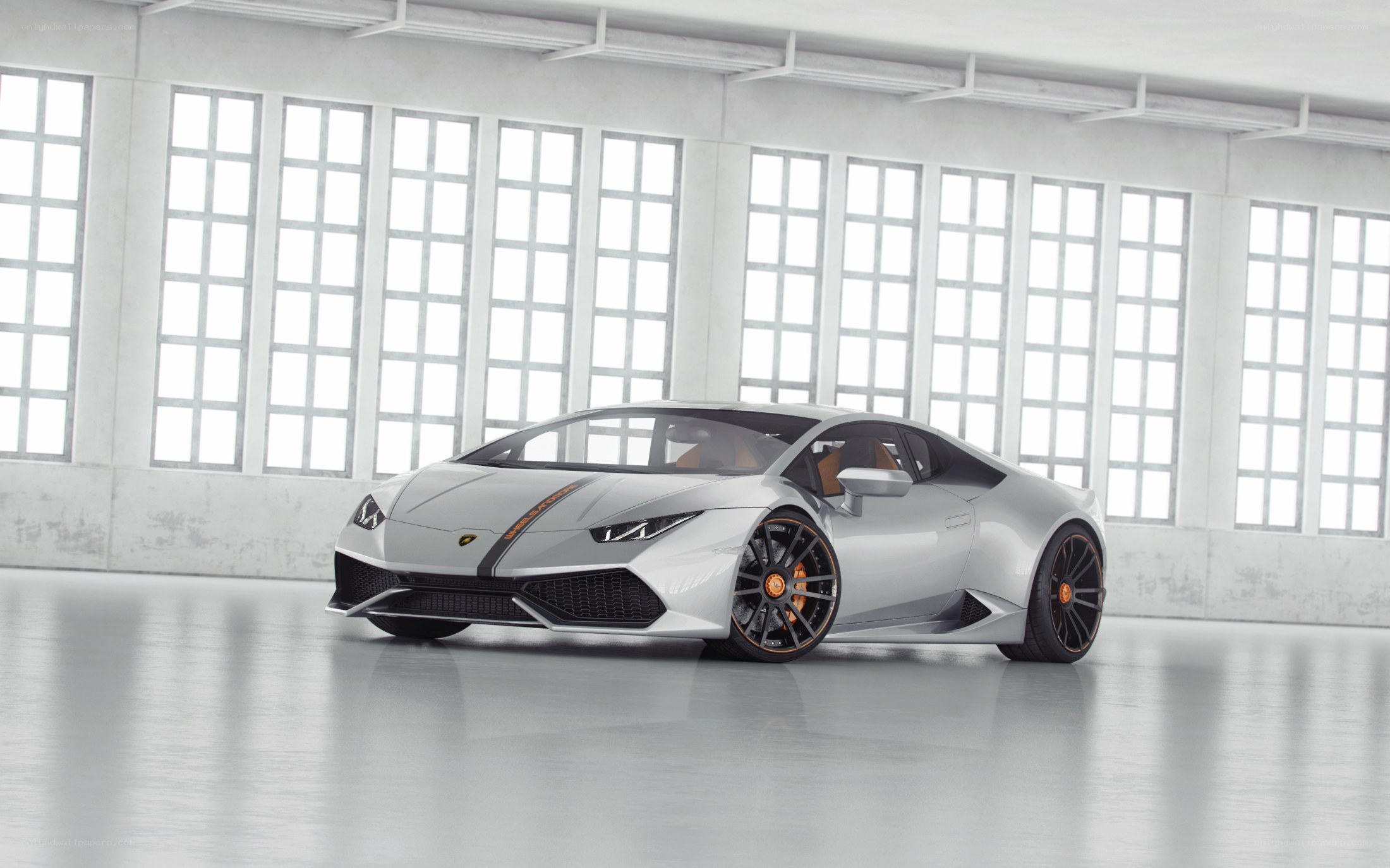 Silver Lamborghini in a warehouse