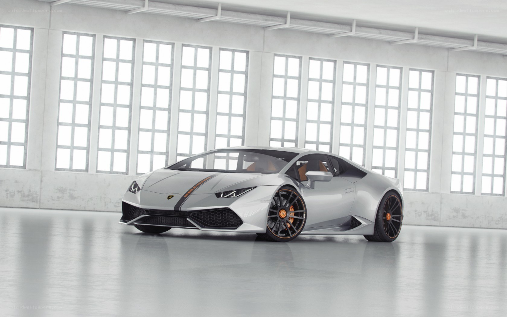 Silver Lamborghini in a warehouse