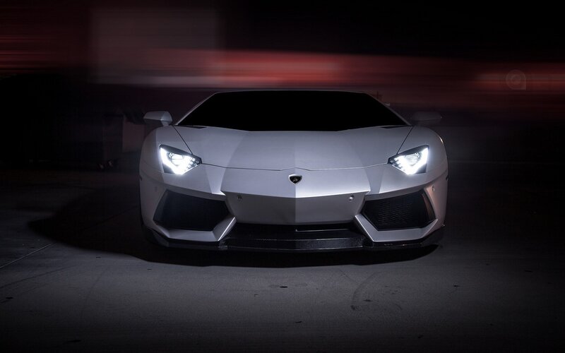 silver lamborghini in dark setting