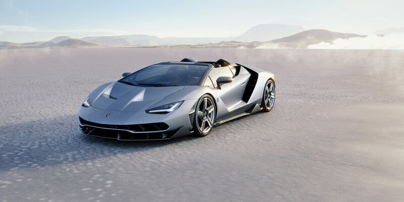 Silver Lamborghini in desert