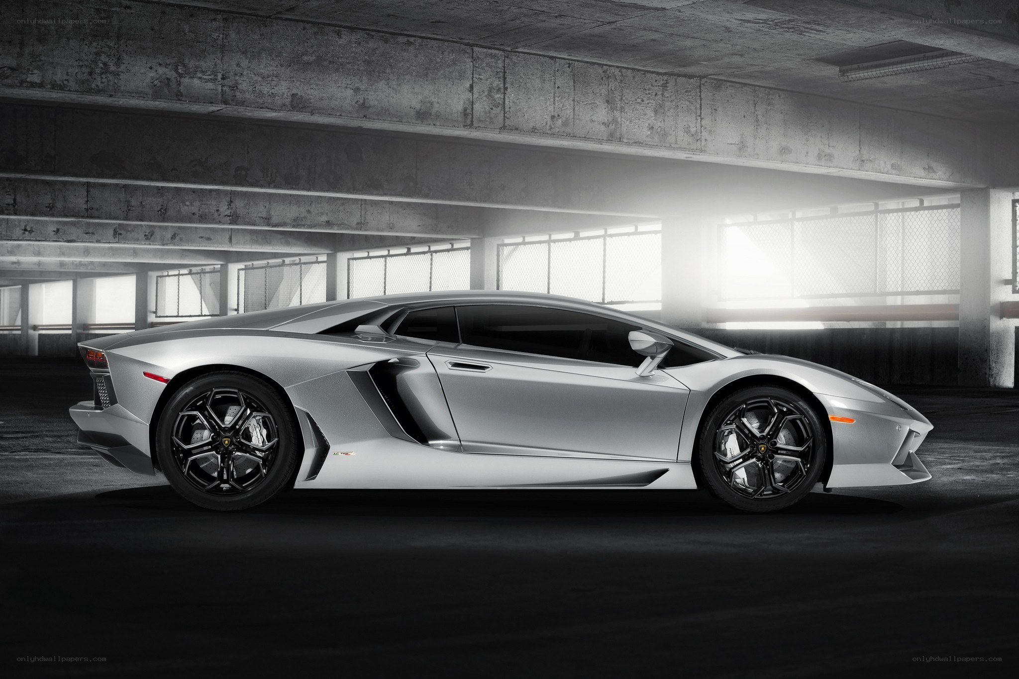 Silver Lamborghini in parking garage