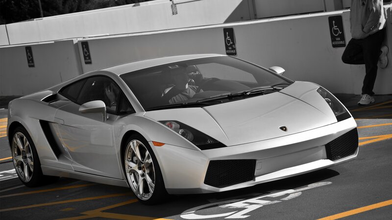 Silver Lamborghini in parking lot