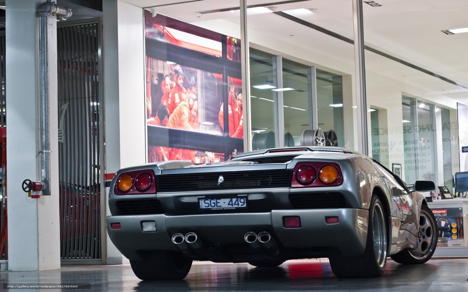 Silver Lamborghini in showroom