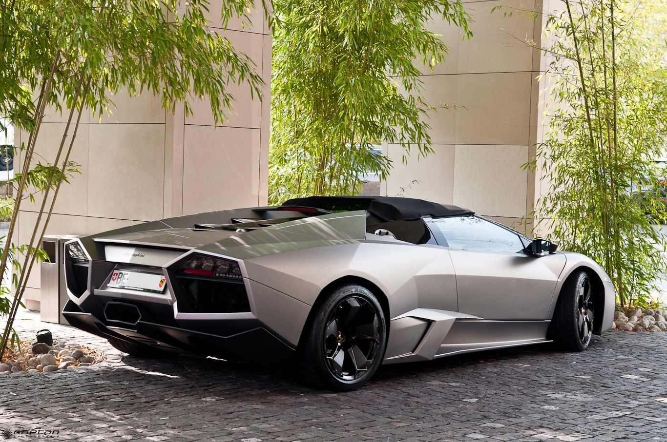Silver Lamborghini parked outside