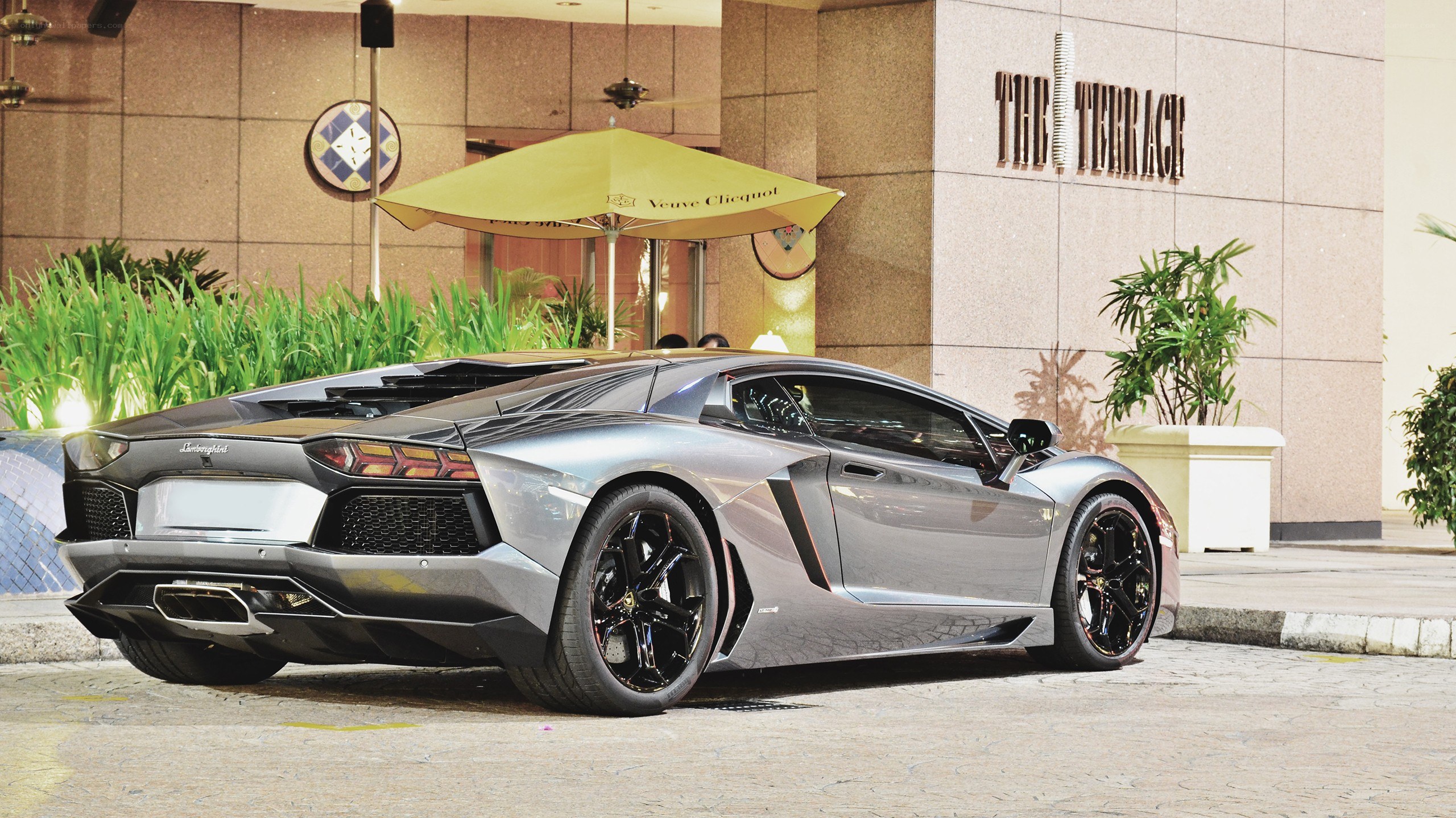 Silver Lamborghini parked outside